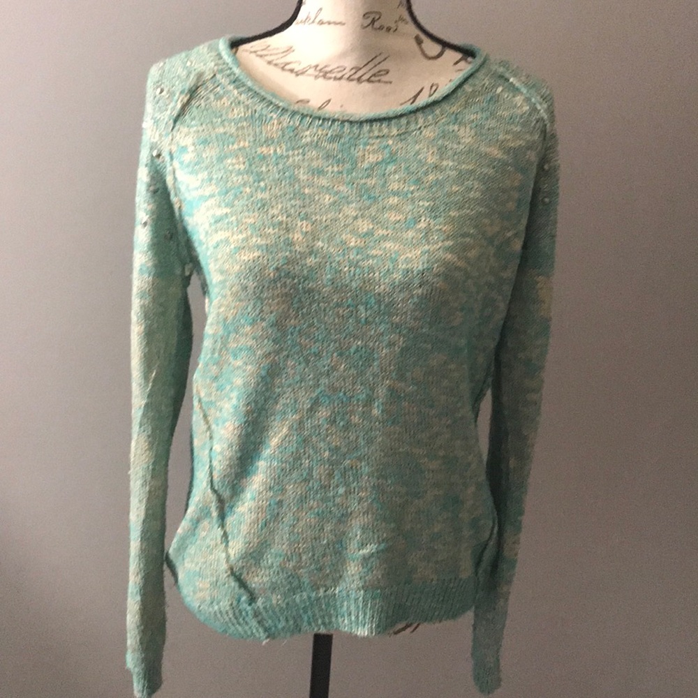 Sweater with studs on shoulder